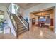 Modern staircase with glass railings and stone flooring at 583 Saint Croix St, Henderson, NV 89012