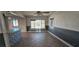 Bright and airy living room featuring tile floors, a ceiling fan, and lots of natural light at 612 Essex East Dr, Las Vegas, NV 89107