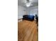 Bedroom with wood floors, ceiling fan, and natural light from the window at 6296 Peach Orchard Rd, Las Vegas, NV 89142