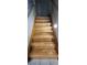 Staircase featuring beautiful hardwood steps and a tile landing at 6296 Peach Orchard Rd, Las Vegas, NV 89142