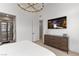 Spacious bedroom with large TV and ensuite bathroom access at 671 Sentinel Spire St, Las Vegas, NV 89138