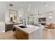 Modern kitchen island with seating and view into living room at 671 Sentinel Spire St, Las Vegas, NV 89138