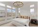 Spacious main bedroom with large windows and a chandelier at 671 Sentinel Spire St, Las Vegas, NV 89138