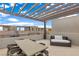 Rooftop deck with pergola, seating, and city views at 671 Sentinel Spire St, Las Vegas, NV 89138