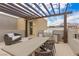 Rooftop deck with pergola, outdoor kitchen, and seating at 671 Sentinel Spire St, Las Vegas, NV 89138