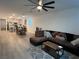 Living room with sectional sofa and view of kitchen and dining area at 6842 Laguna Blanca St, North Las Vegas, NV 89086