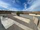 Spacious backyard featuring a gravel area, concrete slabs and block wall, perfect for outdoor entertaining at 7237 William Anders Ave, Las Vegas, NV 89145