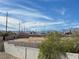 Backyard view with block wall fence and a distant mountain view under a blue sky at 7237 William Anders Ave, Las Vegas, NV 89145