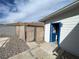 View of backyard with fencing and shed with blue door at 7237 William Anders Ave, Las Vegas, NV 89145