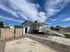 Backyard with covered deck, staircase, shed and gravel at 7237 William Anders Ave, Las Vegas, NV 89145