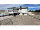 Backyard with covered deck, staircase, shed and gravel at 7237 William Anders Ave, Las Vegas, NV 89145