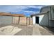 View of backyard with fencing and shed with blue door at 7237 William Anders Ave, Las Vegas, NV 89145