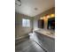 Bathroom featuring double sink vanity, framed mirrors, new fixtures and neutral paint at 7237 William Anders Ave, Las Vegas, NV 89145