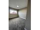 Neutral bedroom featuring a window with carpet at 7237 William Anders Ave, Las Vegas, NV 89145