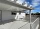 View of the spacious outdoor deck, featuring a patio cover and gray painted wood at 7237 William Anders Ave, Las Vegas, NV 89145