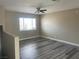 Spacious living room featuring modern gray flooring and neutral wall colors at 7237 William Anders Ave, Las Vegas, NV 89145