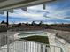 Backyard with a fenced kidney-shaped pool and artificial turf seen from the upper deck at 7237 William Anders Ave, Las Vegas, NV 89145