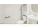 Clean and bright bathroom with pedestal sink and storage cabinet at 7239 Proud Patriot St, Las Vegas, NV 89148