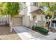 Two-story house with beige exterior, shutters, and landscaping at 7239 Proud Patriot St, Las Vegas, NV 89148