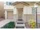 Front entrance of a two-story house with a decorative door at 7239 Proud Patriot St, Las Vegas, NV 89148