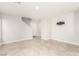 Living room with tile floors and a view of the stairway at 7239 Proud Patriot St, Las Vegas, NV 89148