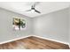 Bright bedroom with ceiling fan, new flooring, and window at 733 Rock Springs Dr # 201, Las Vegas, NV 89128