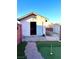 Backyard features exterior building, putting green, and gated entrance at 7415 Constantinople Ave, Las Vegas, NV 89129