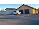 Two-car garage with attached workshop and spacious driveway at 7415 Constantinople Ave, Las Vegas, NV 89129