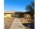 This home's front exterior features a walkway and desert landscaping at 7415 Constantinople Ave, Las Vegas, NV 89129