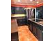 Spacious kitchen featuring dark wood cabinets, granite countertops, and stainless steel appliances at 7415 Constantinople Ave, Las Vegas, NV 89129