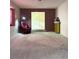 Living room with red chair and open floor plan at 7415 Constantinople Ave, Las Vegas, NV 89129