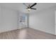 Bright bedroom with wood-look floors and ceiling fan at 7933 Delbonita Ave, Las Vegas, NV 89147