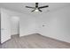 Bright bedroom with wood-look floors and ceiling fan at 7933 Delbonita Ave, Las Vegas, NV 89147