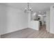 Dining area with chandelier and view into kitchen at 7933 Delbonita Ave, Las Vegas, NV 89147