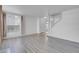 Living room with staircase and large window, light grey flooring at 7933 Delbonita Ave, Las Vegas, NV 89147