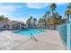 Community pool with palm trees and a gated area at 7933 Delbonita Ave, Las Vegas, NV 89147