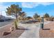 Landscaped walking path with desert plants and trees at 7933 Delbonita Ave, Las Vegas, NV 89147