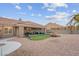 Spacious backyard with patio, putting green, and play area at 8044 Edward Baher Ave, Las Vegas, NV 89149