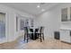 Bright breakfast nook features a glass table and four chairs, bathed in natural light at 8044 Edward Baher Ave, Las Vegas, NV 89149