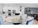 Kitchen with a dining area and view into the living room at 8044 Edward Baher Ave, Las Vegas, NV 89149