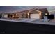 Single-story home with a two-car garage and desert landscaping at 8044 Edward Baher Ave, Las Vegas, NV 89149