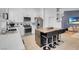 Modern kitchen with white shaker cabinets, stainless steel appliances and a butcher block island at 8044 Edward Baher Ave, Las Vegas, NV 89149