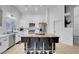 Modern kitchen with white shaker cabinets, stainless steel appliances and a butcher block island at 8044 Edward Baher Ave, Las Vegas, NV 89149