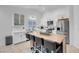 Modern kitchen with white shaker cabinets, stainless steel appliances, and a butcher block island at 8044 Edward Baher Ave, Las Vegas, NV 89149