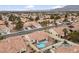 Aerial view of house with pool and neighborhood at 8212 Bolingbrook Ave, Las Vegas, NV 89149