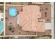 Aerial view of house, pool, and surrounding desert landscape at 8212 Bolingbrook Ave, Las Vegas, NV 89149