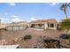 Landscaped backyard with a pool and patio area at 8212 Bolingbrook Ave, Las Vegas, NV 89149