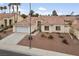 Single-story home with a two-car garage and desert landscaping at 8212 Bolingbrook Ave, Las Vegas, NV 89149