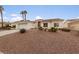 Single-story home with a two-car garage and desert landscaping at 8212 Bolingbrook Ave, Las Vegas, NV 89149