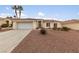 House exterior featuring a garage and rock landscaping at 8212 Bolingbrook Ave, Las Vegas, NV 89149